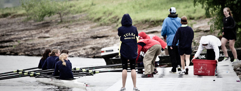 Rowers docking a boat